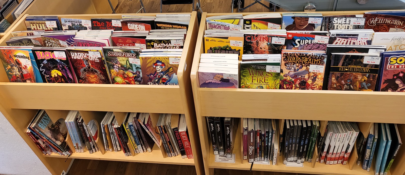 Scrolling racks with new comic books for adults