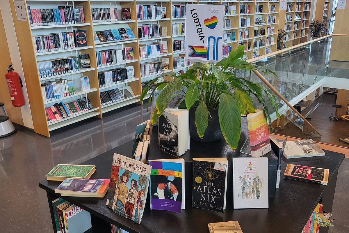 Picture of books on a table, related to LGBTQIA+